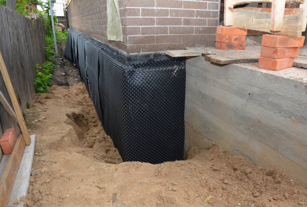 Happy homeowners after waterproofing job in Morton
